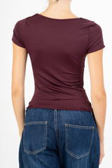 Maglia Charm Detail con accessorio.