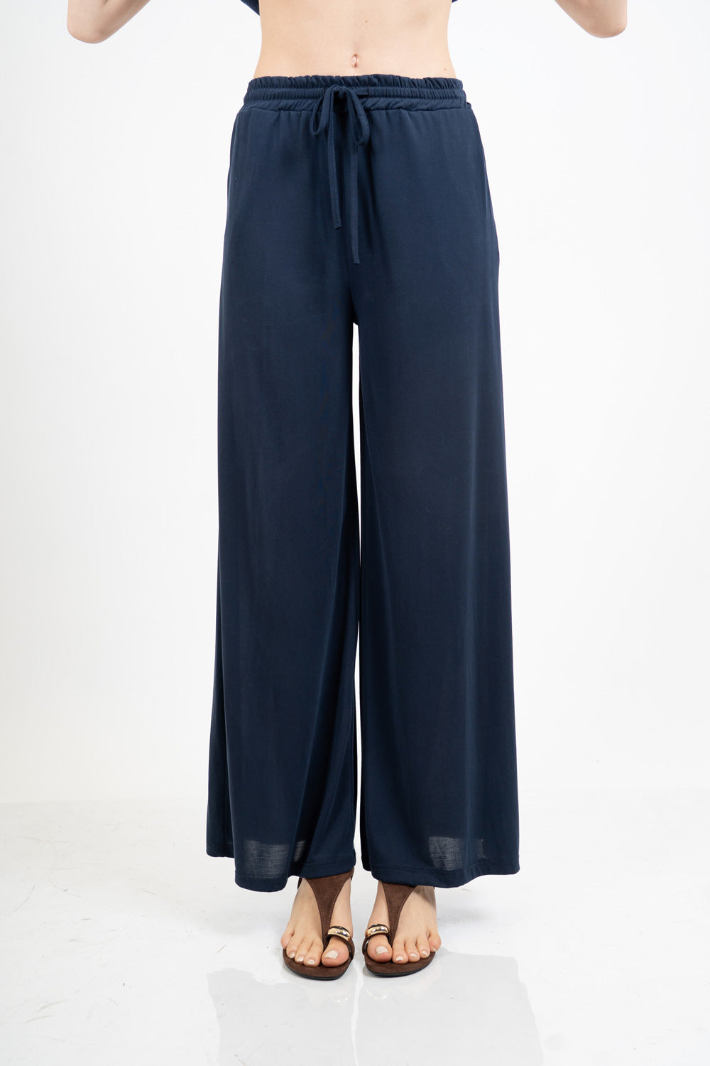 Pantalone palazzo in viscosa elasticizzata con coulisse Made in Italy.