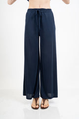 Pantalone palazzo in viscosa elasticizzata con coulisse Made in Italy.