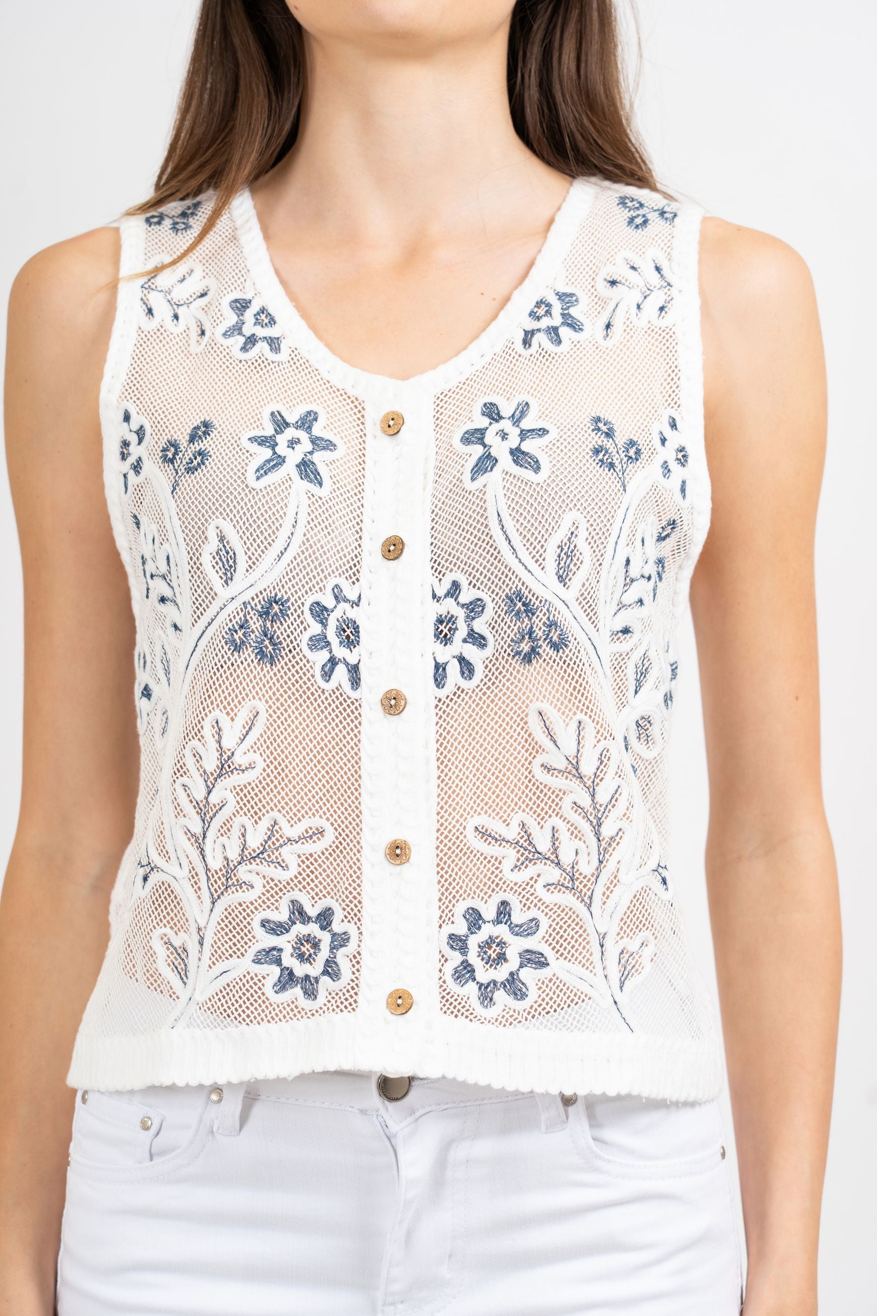 Gilet rete ricamata a fiori.