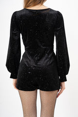 modella indossando Tutina velluto elasticizzato con punti luce e minigonna incrociata colore