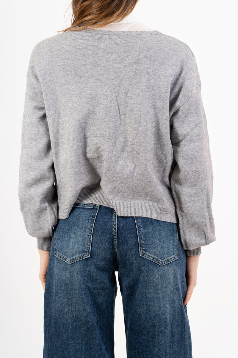 modella indossando Cardigan ampio con scollo a V e maniche a palloncino colore