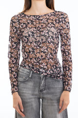 modella indossando Maglia in pizzo elasticizzato trasparente a fiori manica lunga colore Nero Unica