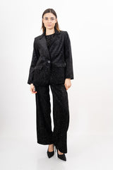 modella indossando Pantalone velluto con punti luce laminati colore Nero Unica