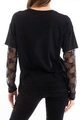 modella indossando Maglia over in cotone elasticizzato con manica lunga in pizzo colore