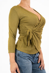 Maglia drappeggiata in viscosa con nodo laterale