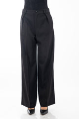 modella indossando Pantalone palazzo donna in tela fluida nera con tasche a scomparsa colore