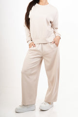 modella indossando Pantalone in misto viscosa con elastico in vita colore Beige Unica