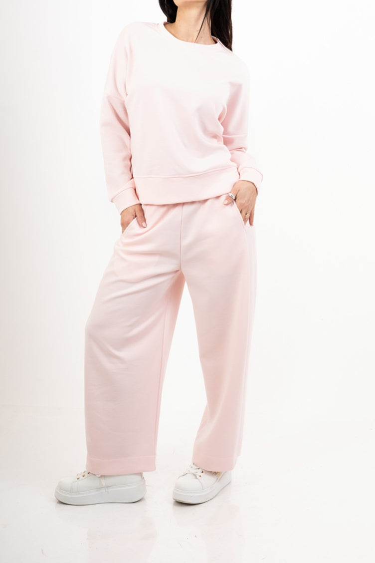 modella indossando Pantalone in misto viscosa con elastico in vita colore Rosa Unica