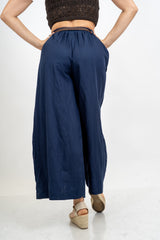 Pantalone balloon cropped in misto lino con cintura intrecciata.