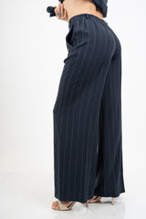 Pantalone palazzo gessato a righe con elastico in vita Made in Italy.