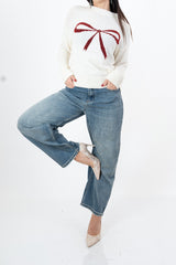 modella indossando Maglione morbido con motivo fiocco e vestibilità comoda colore