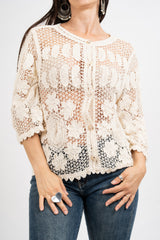 Giacchetto crochet a rete floreale.
