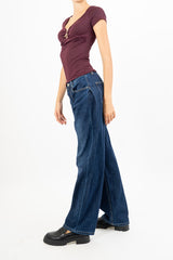 Jeans con pences laterali