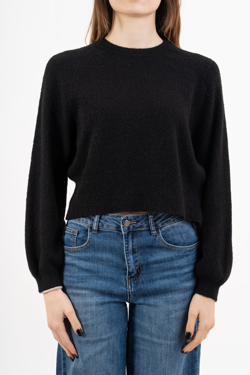 modella indossando Maglione morbido con manica ampia e bordo a costine colore Nero Unica