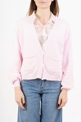 modella indossando Cardigan ampio con scollo a V e maniche a palloncino colore Rosa Unica
