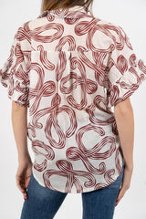 Camicia fantasia astratta in cotone con manica ampia.