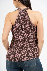 Top floreale in viscosa con scollo all’americana e apertura a goccia sul retro.