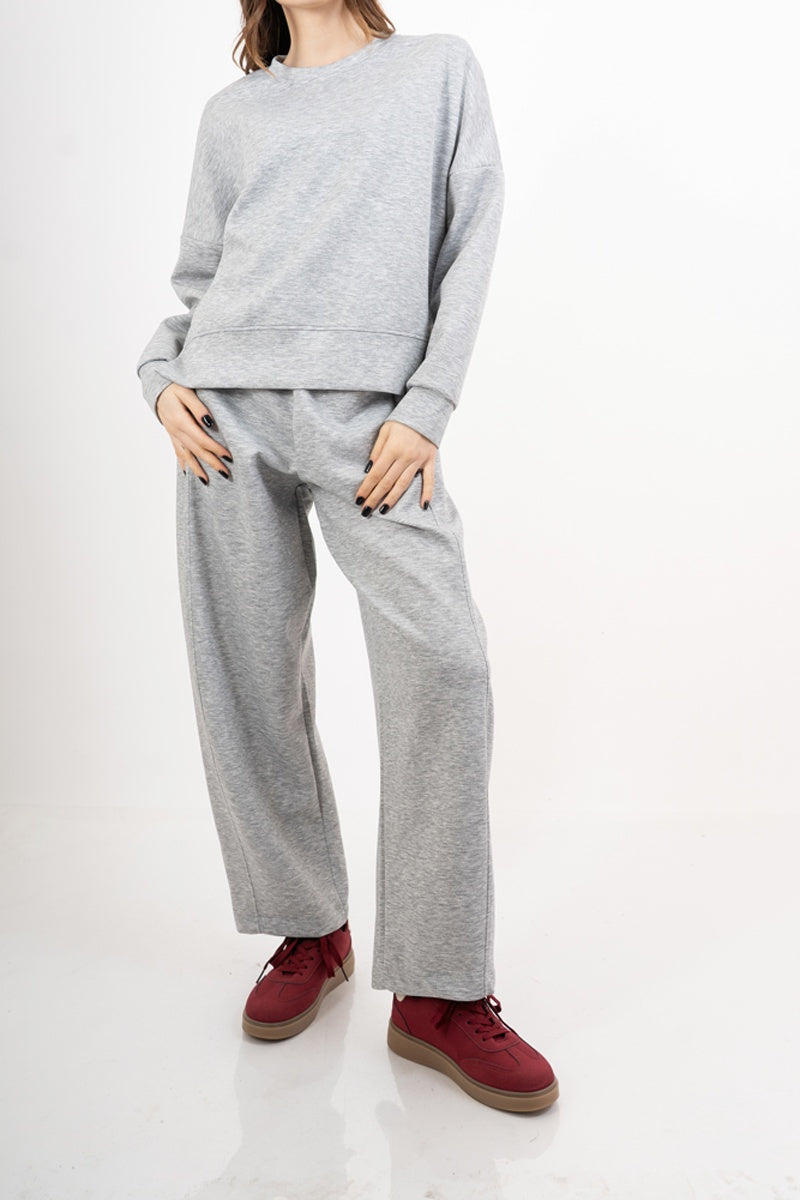 modella indossando Pantalone palazzo felpa con elastico colore Grigio Unica