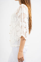 Giacchetto crochet a rete floreale.