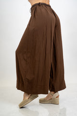 Pantalone balloon cropped in misto lino con cintura intrecciata.
