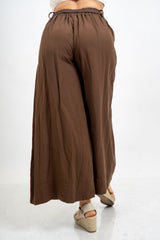 Pantalone balloon cropped in misto lino con cintura intrecciata.