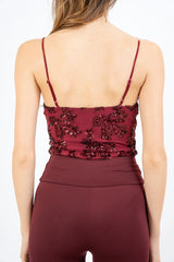 modella indossando Body bustier in microrete con paillettes colore