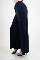 Pantalone palazzo in viscosa elasticizzata con coulisse Made in Italy.