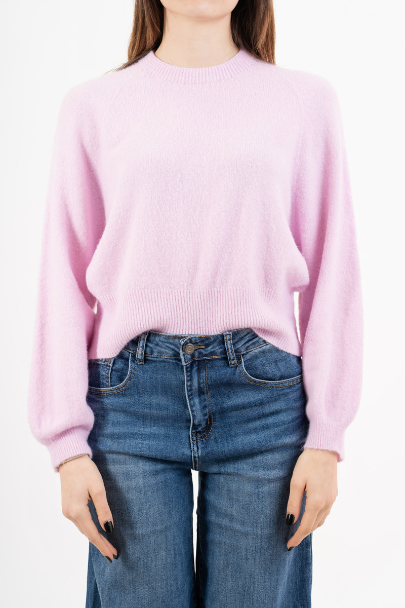 modella indossando Maglione morbido con manica ampia e bordo a costine colore Rosa Unica