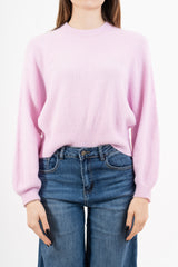 modella indossando Maglione morbido con manica ampia e bordo a costine colore Rosa Unica