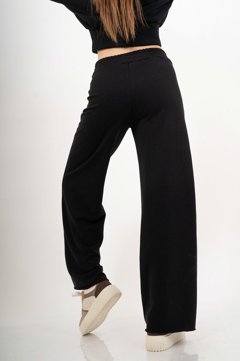 modella indossando Pantalone palazzo in felpa elasticizzata con coulisse colore