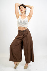 Pantalone balloon cropped in misto lino con cintura intrecciata.