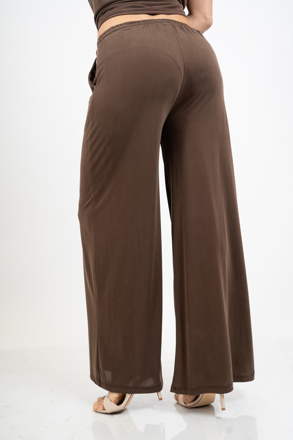 Pantalone palazzo in viscosa elasticizzata con coulisse Made in Italy.