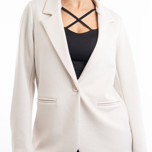 modella indossando Giacca in felpa con collo a lancia e bottone singolo colore Beige Unica