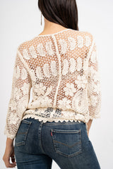 Giacchetto crochet a rete floreale.