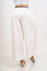Pantalone balloon cropped in misto lino con cintura intrecciata.