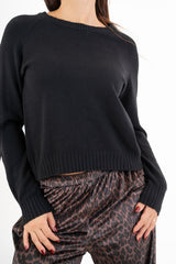 modella indossando Maglione sportivo con maniche raglan e bordo a coste colore Nero Unica