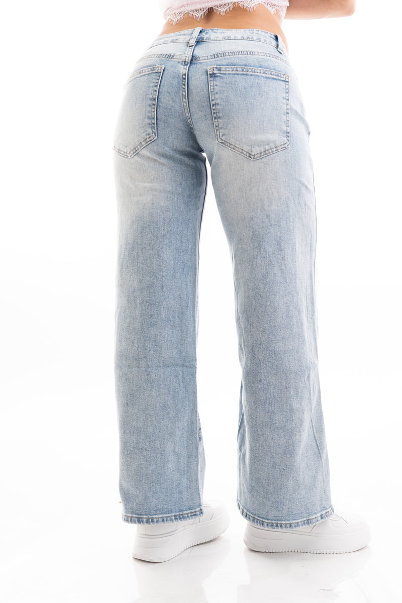 modella indossando Jeans wide leg a vita media in premium denim colore