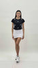 T-shirt in cotone elasticizzato con applicazioni floreali e piume