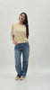 Jeans slouchy in denim con gamba morbida e pinces al ginocchio