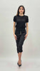 Pantalone modello chinos in cotone elasticizzato colore nero con bottoni gioiello a cuore