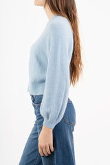 modella indossando Maglione morbido con manica ampia e bordo a costine colore