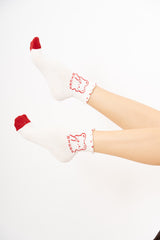 modella indossando Calzini donna fantasia mucca in cotone colore PANNA Unica