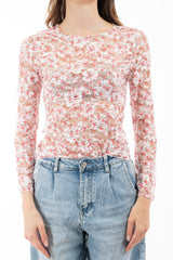 modella indossando Maglia in pizzo elasticizzato trasparente a fiori manica lunga colore Rosa Unica