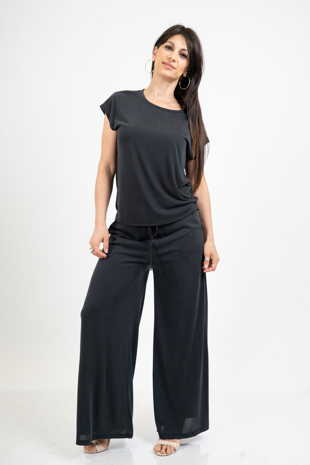 Pantalone palazzo in viscosa elasticizzata con coulisse Made in Italy.
