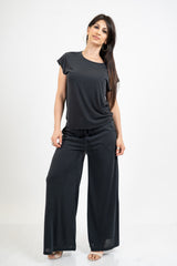 Pantalone palazzo in viscosa elasticizzata con coulisse Made in Italy.